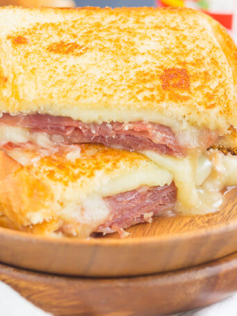 This Prosciutto, Raspberry and Brie Grilled Cheese is loaded with fresh slices of prosciutto, raspberry jam, brie and mozzarella cheeses. Grilled until golden and melty, this sandwich is the perfect comfort dish!