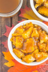 top down view of pumpkin dessert in a white cup with caramel sauce