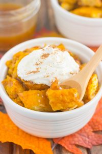 zoomed in shot of spoon scooping out pumpkin bread pudding