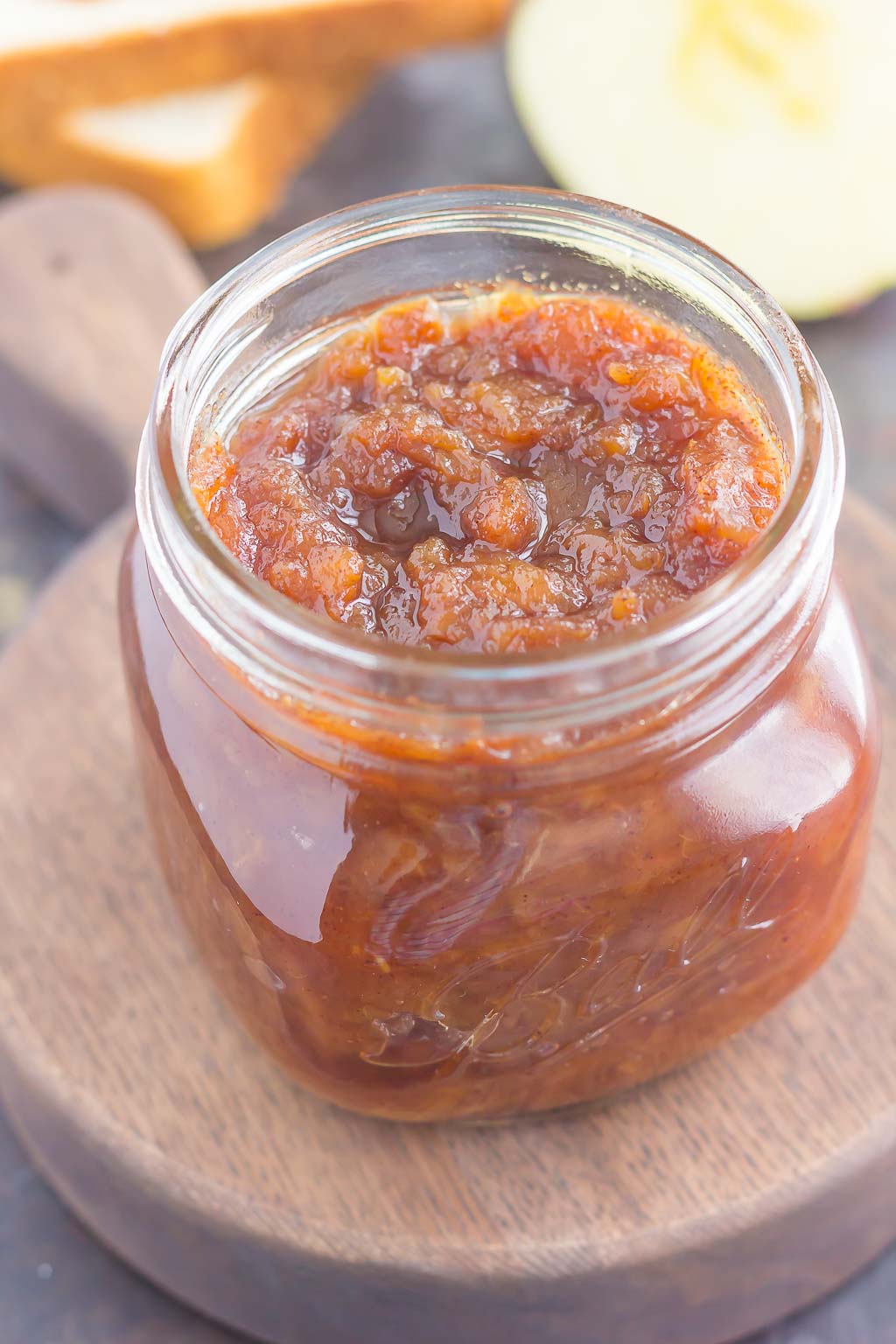 glass jar full of crockpot apple butter