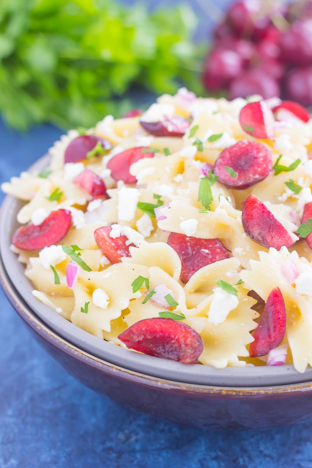 This Cherry Balsamic Pasta Salad is packed with fresh cherries, red onion, and feta cheese, all topped with a light white balsamic dressing. Easy to make and bursting with flavor, this salad is the perfect summer dish to enjoy all season long!