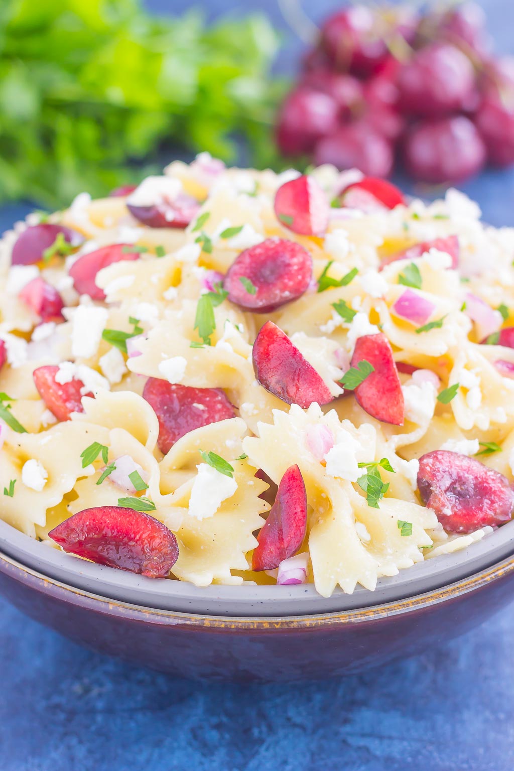 This Cherry Balsamic Pasta Salad is packed with fresh cherries, red onion, and feta cheese, all topped with a light white balsamic dressing. Easy to make and bursting with flavor, this salad is the perfect summer dish to enjoy all season long!