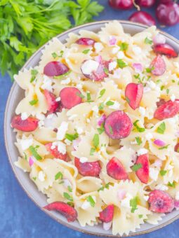 This Cherry Balsamic Pasta Salad is packed with fresh cherries, red onion, and feta cheese, all topped with a light white balsamic dressing. Easy to make and bursting with flavor, this salad is the perfect summer dish to enjoy all season long!