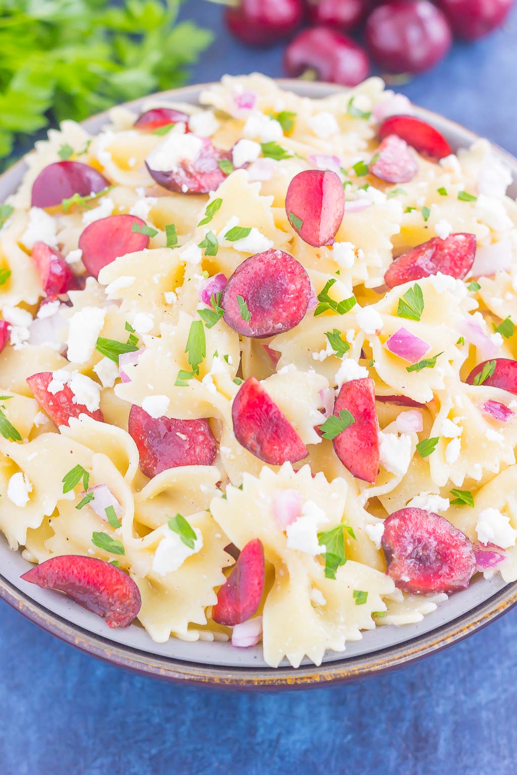 This Cherry Balsamic Pasta Salad is packed with fresh cherries, red onion, and feta cheese, all topped with a light white balsamic dressing. Easy to make and bursting with flavor, this salad is the perfect summer dish to enjoy all season long!