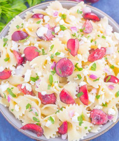 This Cherry Balsamic Pasta Salad is packed with fresh cherries, red onion, and feta cheese, all topped with a light white balsamic dressing. Easy to make and bursting with flavor, this salad is the perfect summer dish to enjoy all season long!