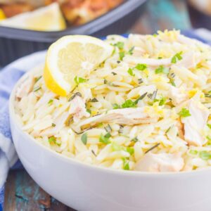 This Lemon Herb Orzo with Chicken is a simple dish that's ready in less than 30 minutes. Packed with shredded chicken, rosemary, thyme, and lemon, this pasta is loaded with flavor and perfect for a summer meal!