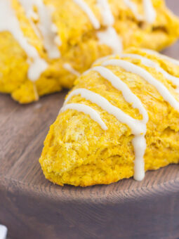 pumpkin scones with maple glaze drizzled on top