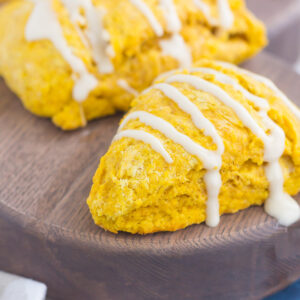 pumpkin scones with maple glaze drizzled on top