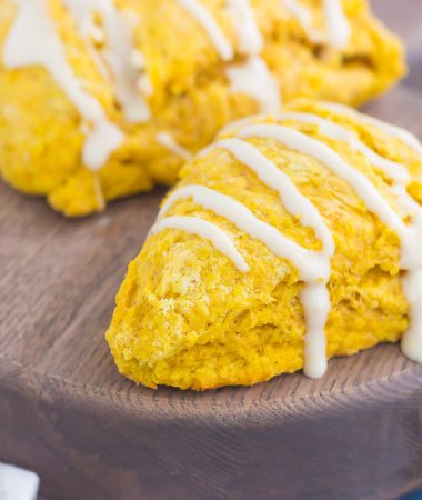 pumpkin scones with maple glaze drizzled on top