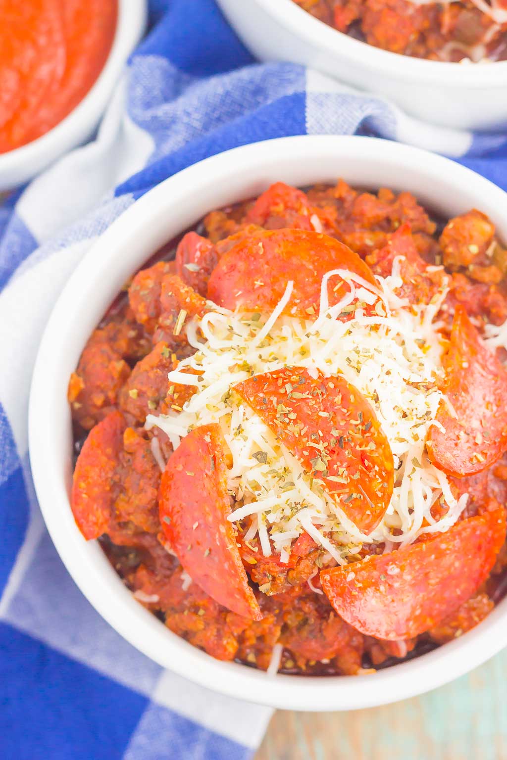 Overhead view of slow cooker no bean pizza chili in a white ramekin. 