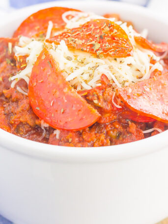 This Slow Cooker Pizza Chili is loaded with ground beef, Italian sausage, pepperoni, and zesty spices. It's a fun twist on a classic comfort dish that will keep you coming back for more!