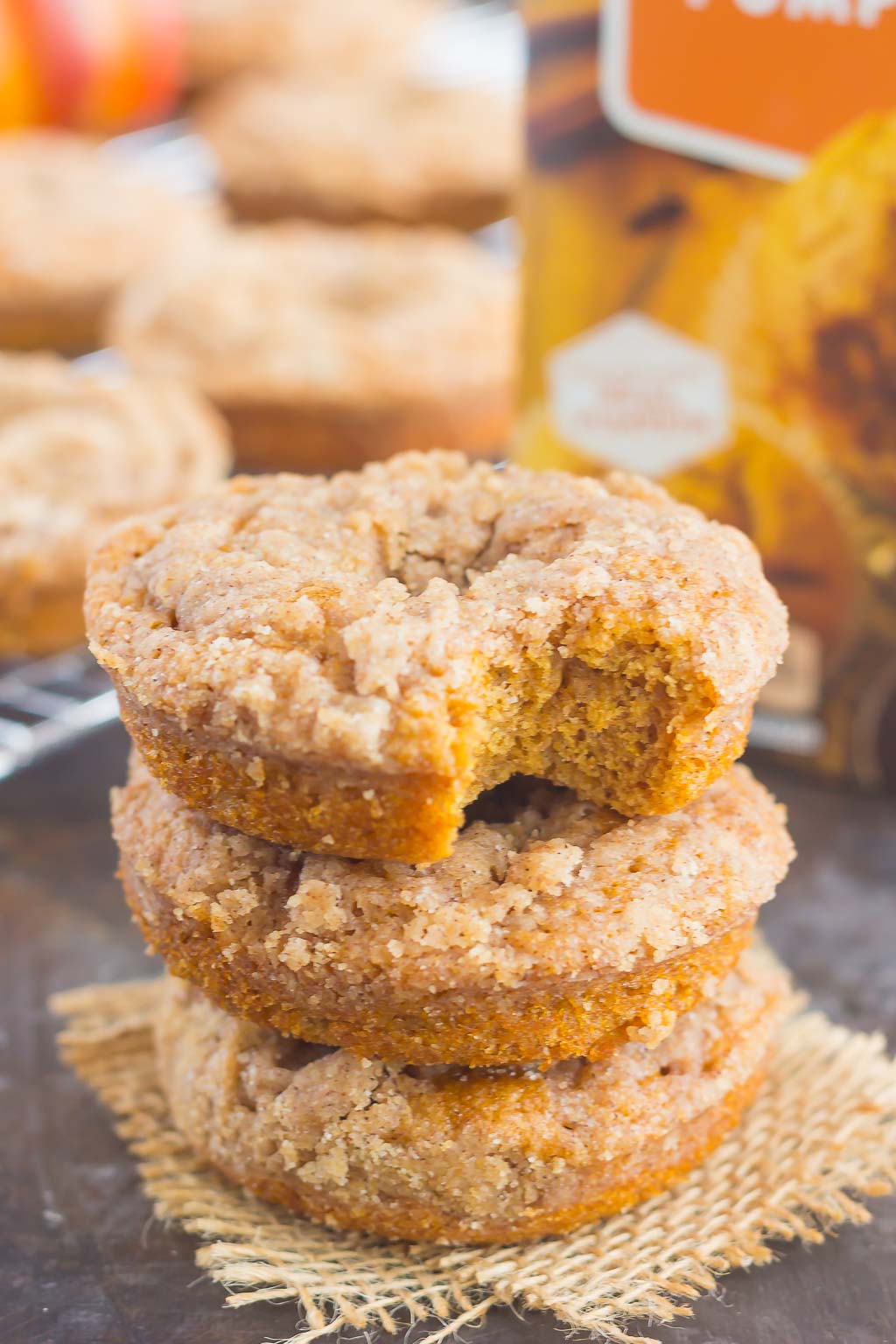 These Baked Pumpkin Streusel Donuts are soft, fluffy, and bursting with pumpkin. Filled with cozy fall flavors and topped with a sweet cinnamon streusel, this easy treat is the perfect fall breakfast or dessert! #pumpkin #pumpkindonuts #bakeddonuts #donutrecipes #fallrecipe #pumpkinrecipe #fallbreakfast #falldessert #pumpkinbreakfast #pumpkindessert #breakfast #dessert