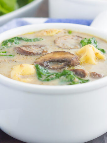 This Creamy Mushroom and Spinach Tortellini Soup is made in one pot and ready in just 30 minutes. Packed with fresh mushrooms, cheese tortellini, and baby spinach, this soup is creamy, comforting, and will warm you right up!