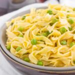 These Creamy Skillet Noodles with Peas are made in one pan and ready in less than 30 minutes. With just a few ingredients, this creamy and flavorful side dish is perfect when paired with just about anything!