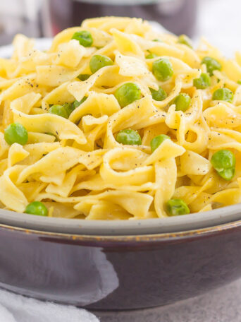 These Creamy Skillet Noodles with Peas are made in one pan and ready in less than 30 minutes. With just a few ingredients, this creamy and flavorful side dish is perfect when paired with just about anything!