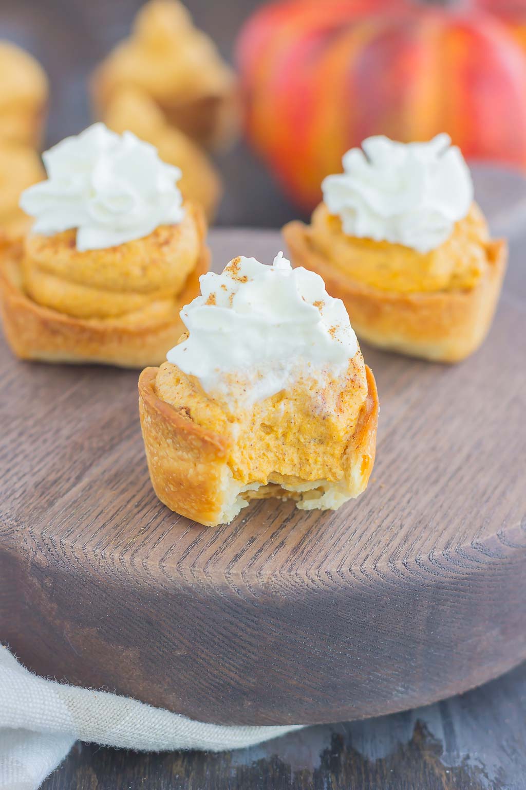 These Whipped Pumpkin Pie Bites are perfectly portable, poppable, and so easy to make. With just a few ingredients and hardly any prep time, you can have your pumpkin pie in bite-sized form! #pumpkin #pumpkinpie #pumpkinpiebites #pumpkinbites #piebites #pumpkinrecipe #fallrecipes #falldessert #pumpkindessert #dessert