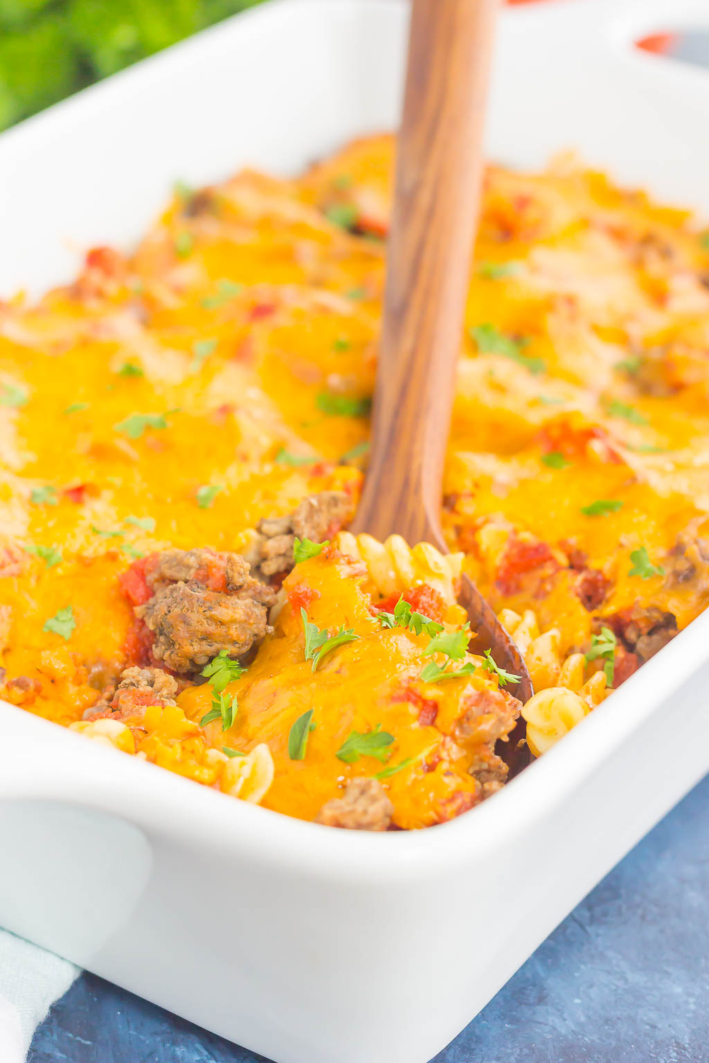 serving spoon resting in dish of cheeseburger casserole