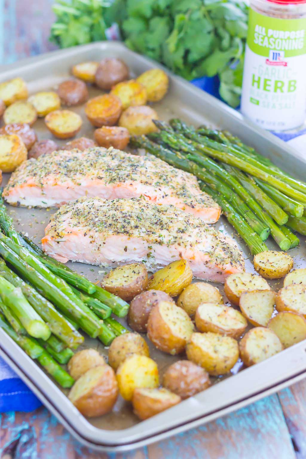 asparagus, salmon and potatoes on a sheet pan