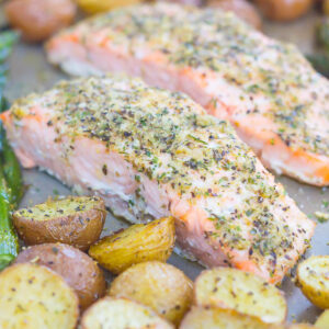 This Sheet Pan Garlic Herb Salmon with Roasted Potatoes and Asparagus makes the perfect meal for busy weeknights. Everything is roasted on one pan, seasoned to perfection and made with just a few ingredients. Easy to make and even better to eat, this one pan meal is sure to be a hit at the dinner table!