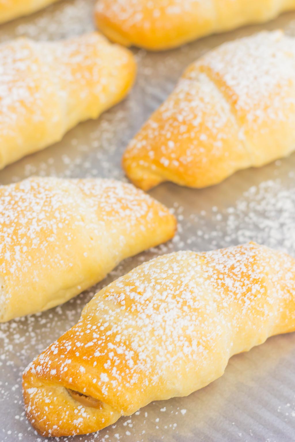 Creamy cookie butter, layered on buttery crescent rolls and topped with chocolate chips creates these decadent Chocolate Cookie Butter Crescents!