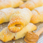 Creamy cookie butter, layered on buttery crescent rolls and topped with chocolate chips creates these decadent Chocolate Cookie Butter Crescents!