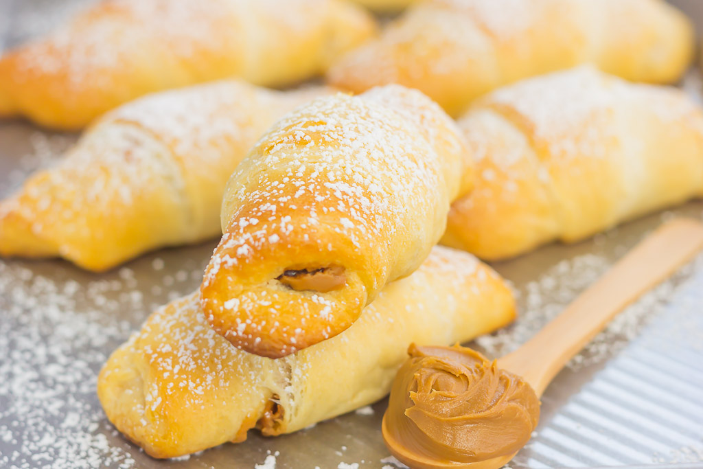 Creamy cookie butter, layered on buttery crescent rolls and topped with chocolate chips creates these decadent Chocolate Cookie Butter Crescents!
