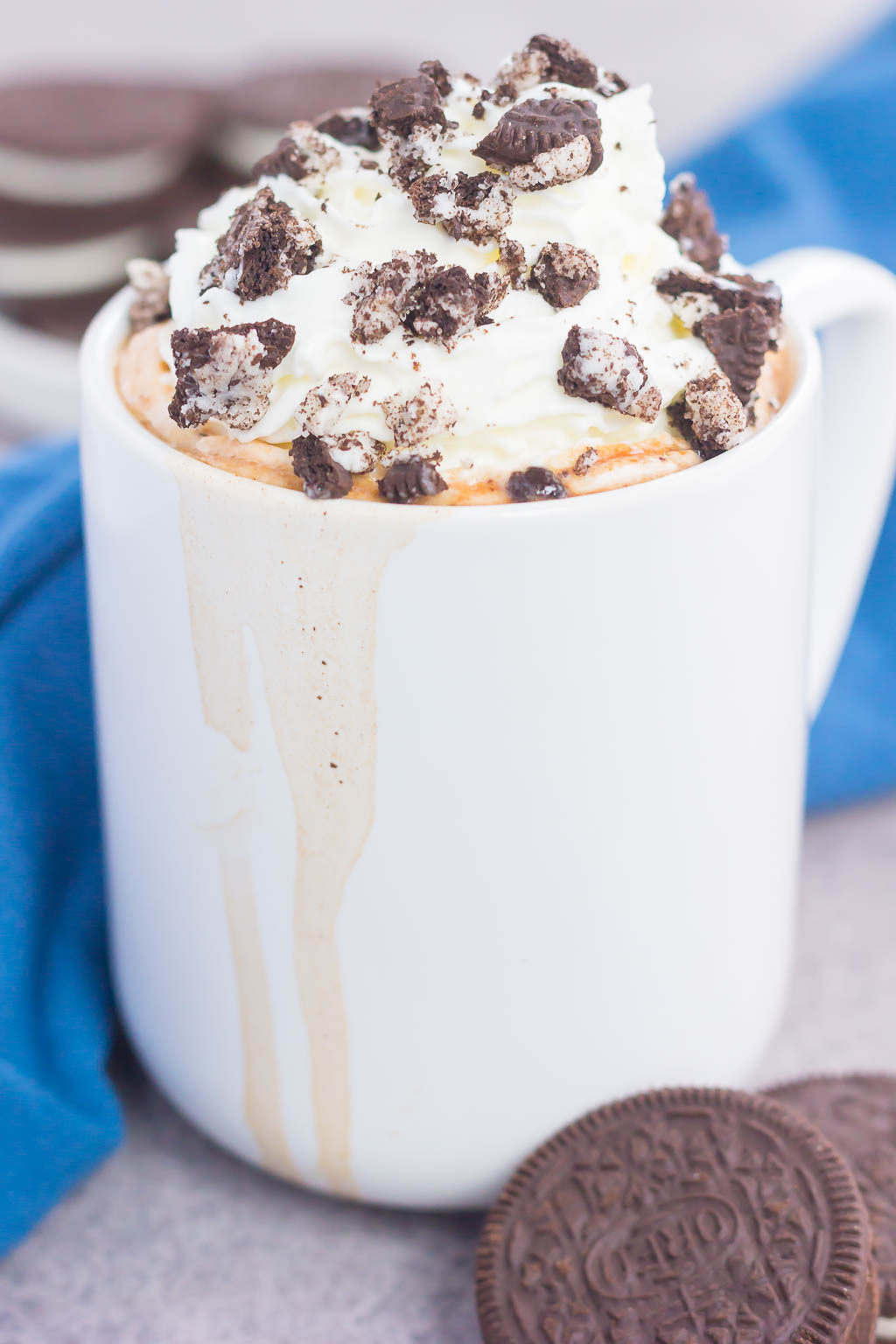 an overflowing mug of oreo hot chocolate