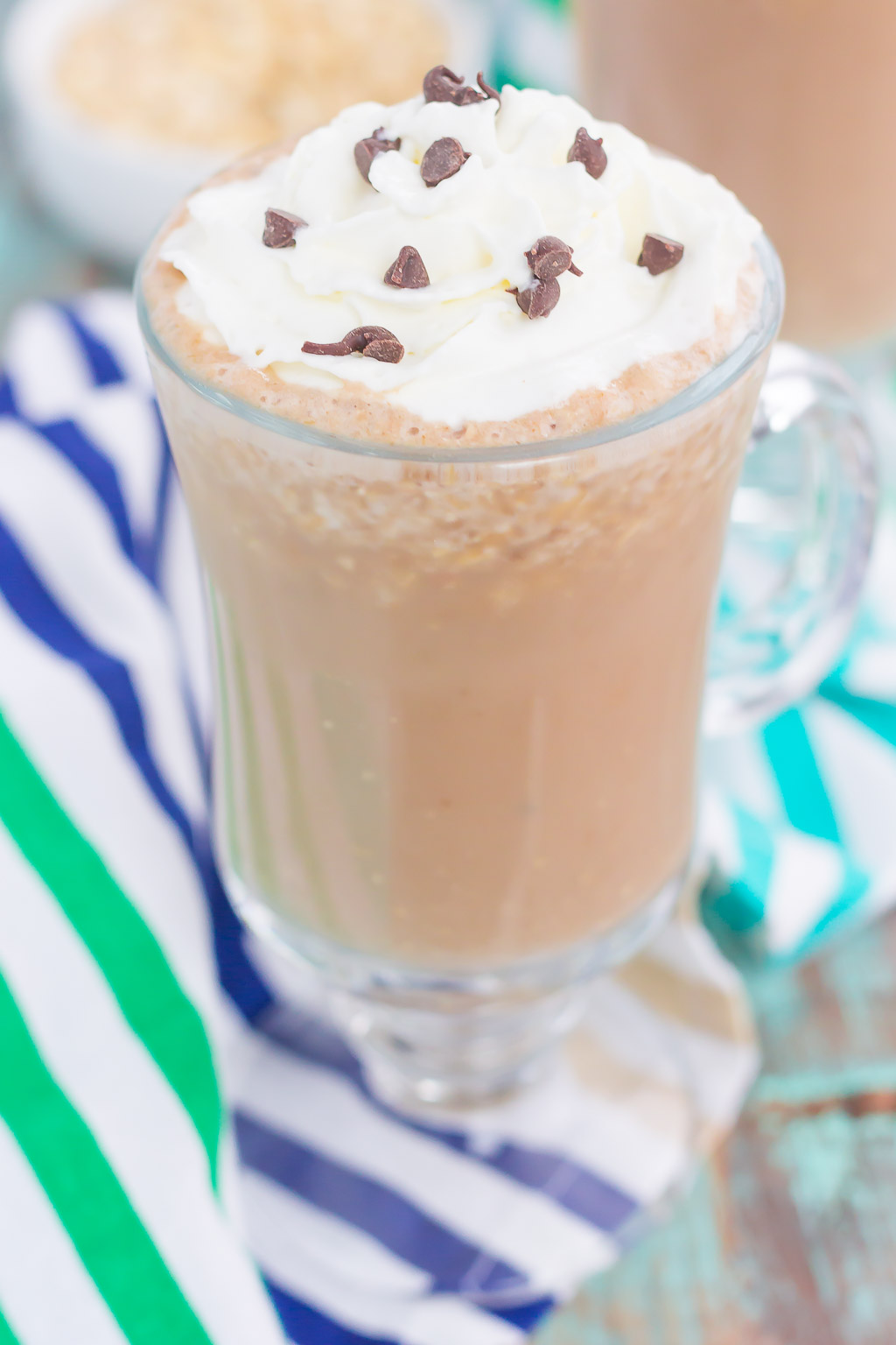 This Iced Coffee Smoothie is the perfect way to get your morning off to a good start. Packed with coffee, oats, honey, and a banana, this healthier drink takes just minutes to make and will keep you going all day long! #coffee #icedcoffee #smoothie #coffeesmoothie #icedcoffeesmoothie #drink