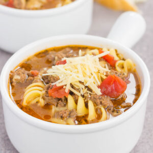 a white soup bowl with lasagna soup in it