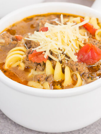 This One Pot Lasagna Soup is tastes just like the classic dish, but without all of the prep work. Everything is tossed into one pot and then simmered until the flavors blend together. Easy to make and full of simple ingredients, this hearty soup will be a meal-time winner all year long!