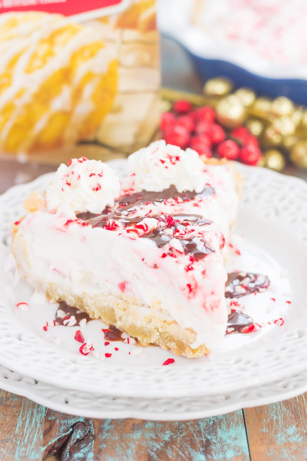This Peppermint Sugar Cookie Ice Cream Pie is an easy dessert that's full of holiday flavors. A buttery sugar cookie crust envelopes creamy peppermint ice cream and is topped with crushed candy canes. It's a simple dessert that is sure to impress everyone this holiday season! #sugarcookies #sugarcookiepie #sugarcookieicecreampie #icecreampie #cookiepie #pepperminticecreampie #christmasdessert #holidaydessert #dessert