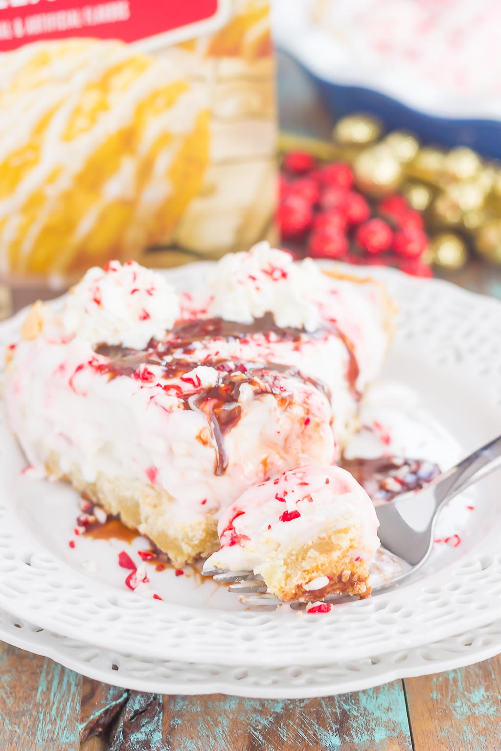 This Peppermint Sugar Cookie Ice Cream Pie is an easy dessert that's full of holiday flavors. A buttery sugar cookie crust envelopes creamy peppermint ice cream and is topped with crushed candy canes. It's a simple dessert that is sure to impress everyone this holiday season!