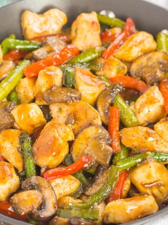 an easy chicken stir-fry with veggies in a pan