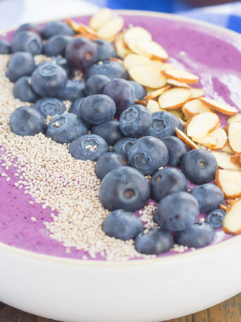 This Blueberries and Cream Smoothie Bowl is just what you need to get you going in the morning. Packed with sweet blueberries, Greek yogurt, and healthier ingredients, this thick and creamy smoothie bowl is loaded with flavor and all of the fun toppings!