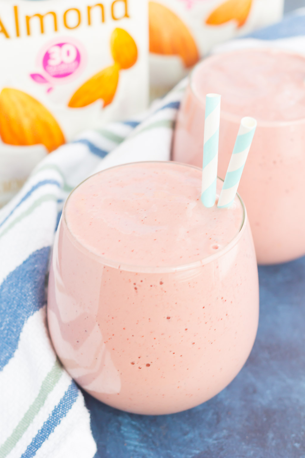 Two frozen cherry smoothies in glasses. 