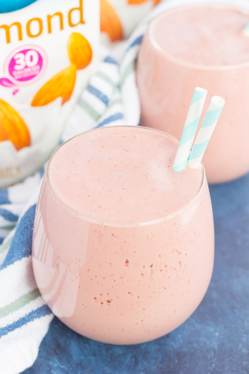 Two glasses of mango cherry smoothie. 