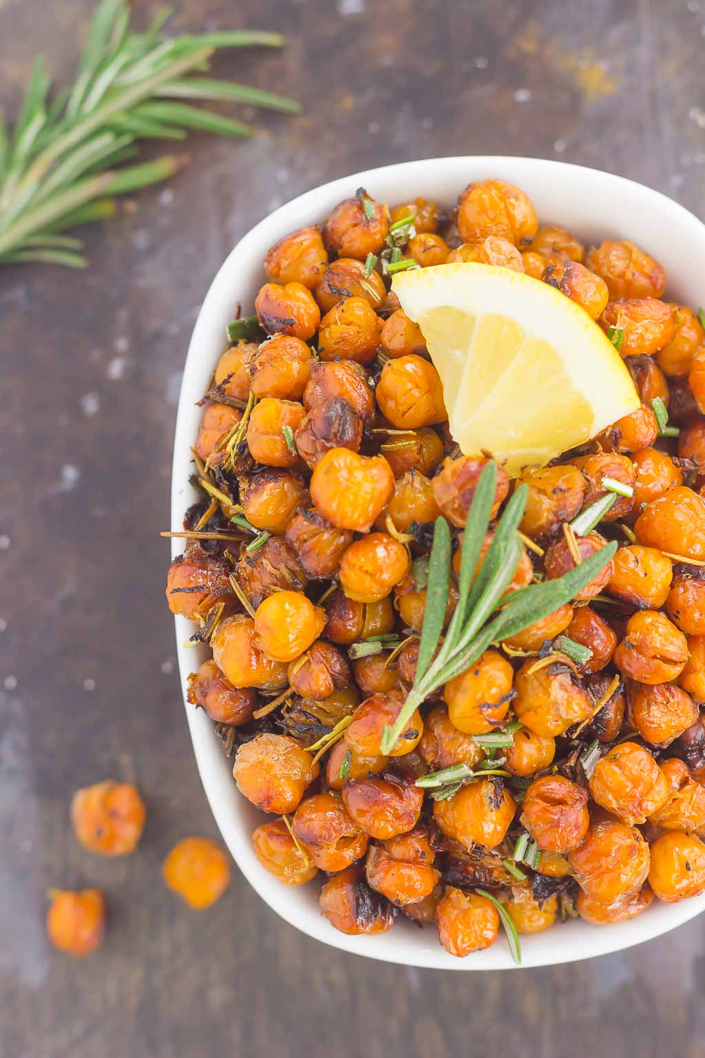 These Roasted Lemon Rosemary Chickpeas make a delicious snack or great addition to salads or soups. Packed with tangy lemon and fresh rosemary, these crunchy chickpeas are easy to make and perfect for when the munchies strike!