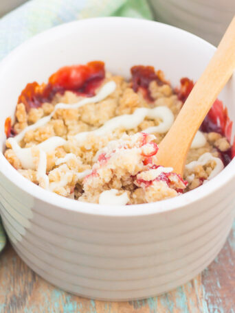 This White Chocolate Raspberry Crumble is packed with a buttery crust that's topped with a sweet raspberry sauce and luscious white chocolate. Baked in mini ramekins and ready in no time, this easy dessert is perfect to for just about any occasion!