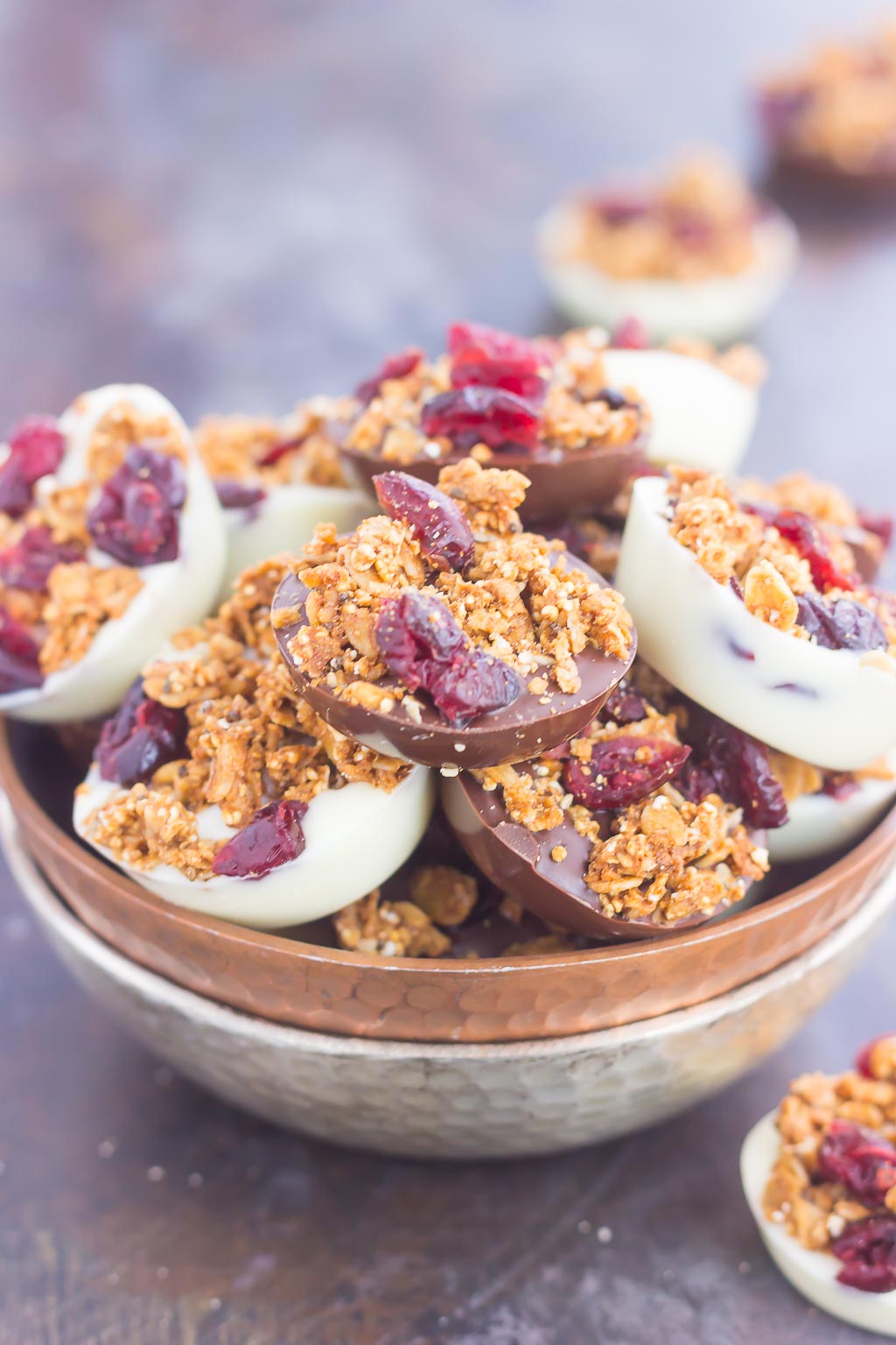 These Chocolate Cherry Granola Cups are the perfect bite for when you want something sweet. Smooth dark chocolate and creamy white chocolate cups are topped with crunchy granola and dried cherries. With no oven needed and ready in minutes, these cups make a delicious dessert or snack!