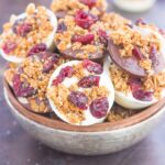 These Chocolate Cherry Granola Cups are the perfect bite for when you want something sweet. Smooth dark chocolate and creamy white chocolate cups are topped with crunchy granola and dried cherries. With no oven needed and ready in minutes, these cups make a delicious dessert or snack!