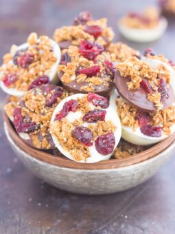 These Chocolate Cherry Granola Cups are the perfect bite for when you want something sweet. Smooth dark chocolate and creamy white chocolate cups are topped with crunchy granola and dried cherries. With no oven needed and ready in minutes, these cups make a delicious dessert or snack!