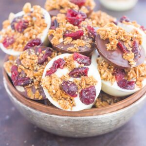 These Chocolate Cherry Granola Cups are the perfect bite for when you want something sweet. Smooth dark chocolate and creamy white chocolate cups are topped with crunchy granola and dried cherries. With no oven needed and ready in minutes, these cups make a delicious dessert or snack!