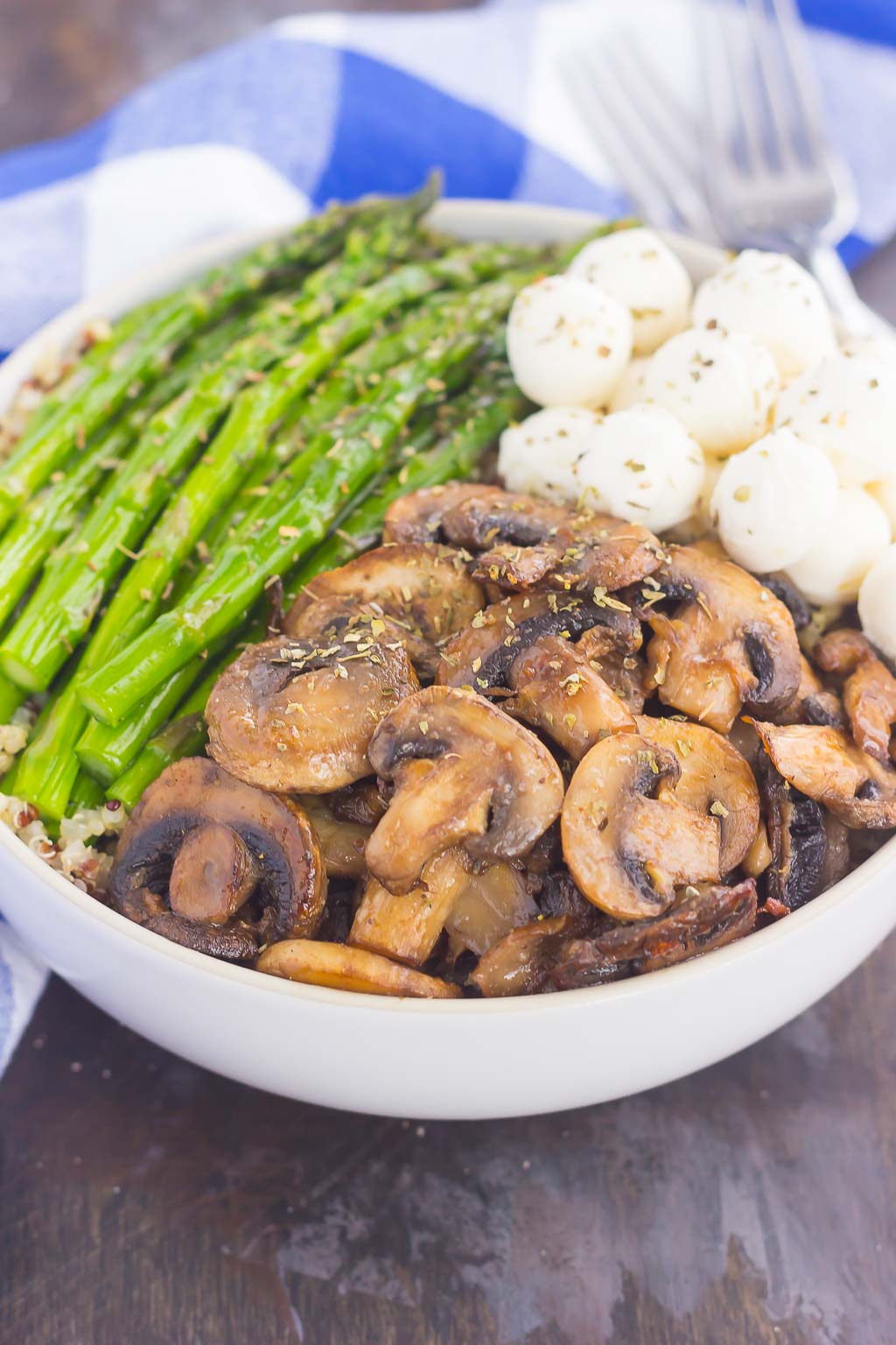 If you’re looking for a new favorite recipe, this Asparagus and Mushroom Quinoa Bowl will become a regular in your meal rotation. Hearty quinoa is tossed in a white balsamic dressing and then topped with roasted asparagus and fresh mushrooms. Fast, fresh and flavorful, this easy meal makes a delicious lunch or dinner!