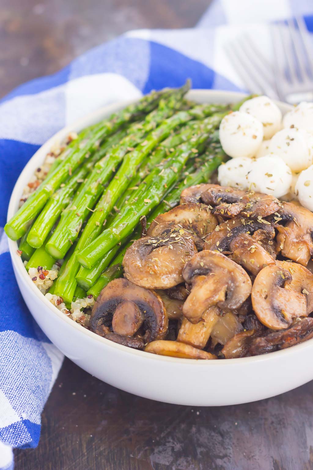 If you’re looking for a new favorite recipe, this Asparagus and Mushroom Quinoa Bowl will become a regular in your meal rotation. Hearty quinoa is tossed in a white balsamic dressing and then topped with roasted asparagus and fresh mushrooms. Fast, fresh and flavorful, this easy meal makes a delicious lunch or dinner!
