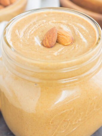 Packed with roasted almonds, sweet honey and splash of coconut oil, this Homemade Honey Almond Butter is smooth, creamy, and oh-so delicious. It's paleo, gluten-free, ready in less than 10 minutes, and so much better than the store-bought kind!