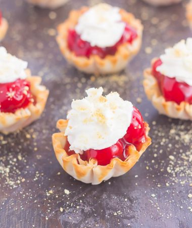These Cherry Pie Bites are simple to make and bursting with the classic pie flavor. With just two ingredients and no oven required, you can have this mini treat ready to go for your parties or get-togethers. Top these bites with a dollop of whipped cream and crushed graham crackers and your easy dessert is ready to impress!