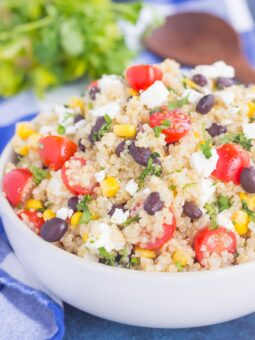 This Corn and Black Bean Quinoa Salad is hearty, on the healthier side, and perfect for a light meal. Quinoa is tossed with black beans, fresh corn, cilantro and tomatoes, and then tossed in a light white balsamic dressing. Loaded with flavor and ready in less than 30 minutes, this simple salad is perfect for lunch or dinner!