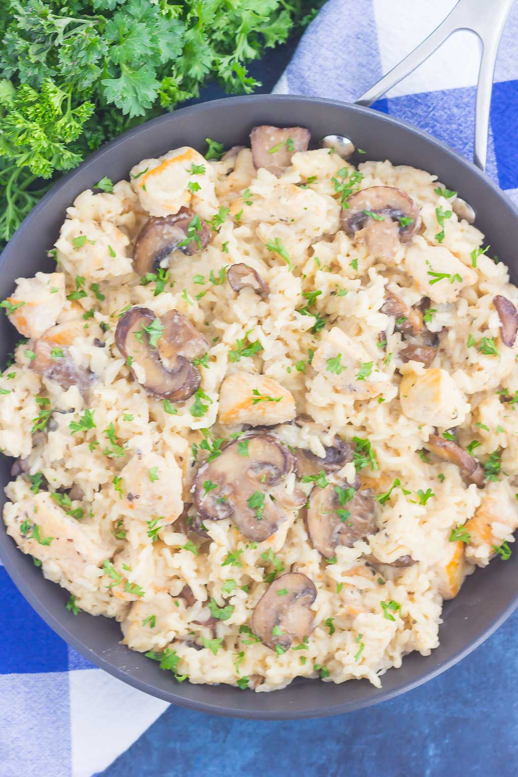 This One Pan Chicken and Mushroom Parmesan Rice is perfect for busy weeknights. Just a few simple ingredients is all it takes for this easy, one pan meal that's packed with flavor. It's guaranteed to be a favorite all year long!