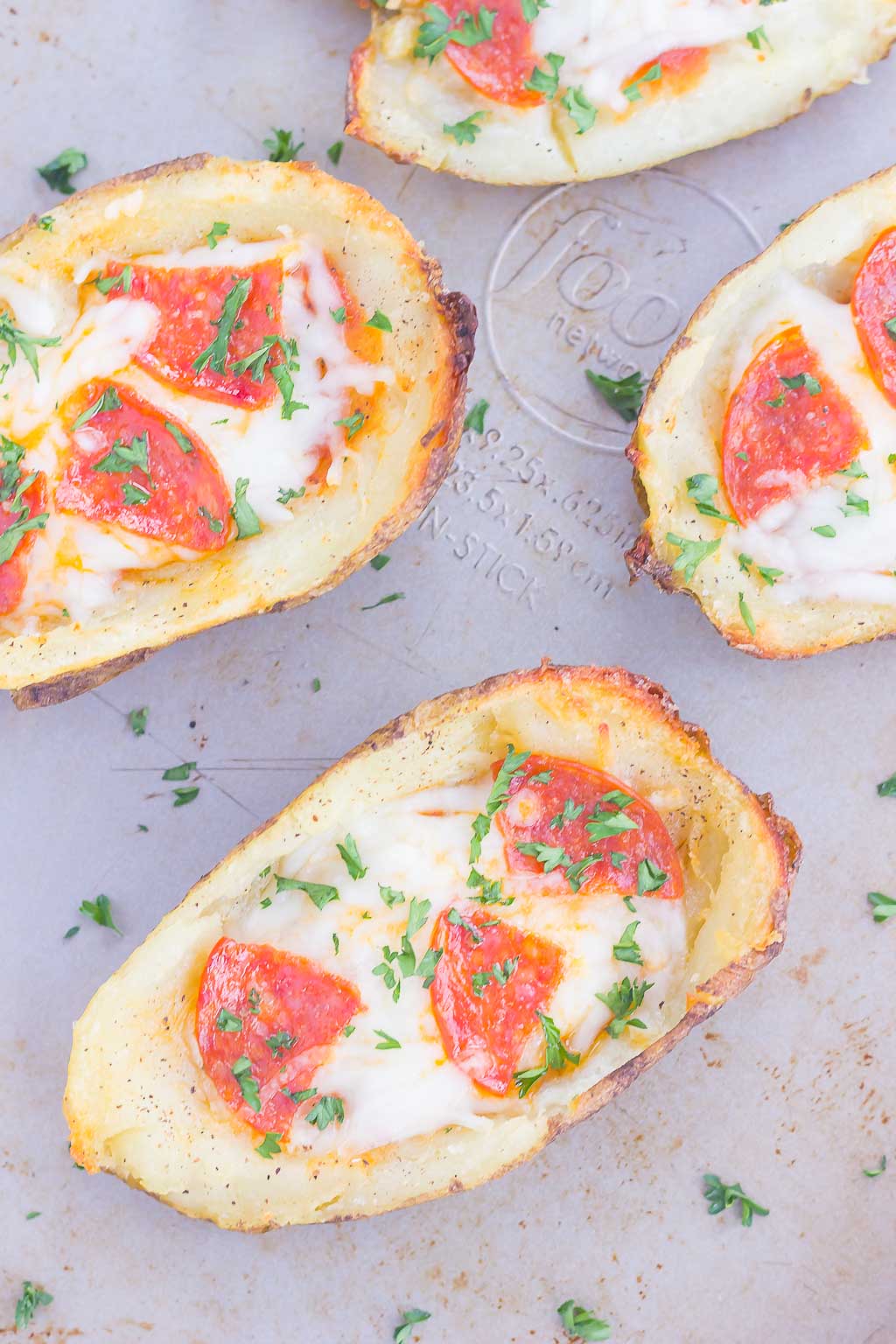 Loaded with pizza sauce, fresh mozzarella cheese, pepperoni and seasonings, these Pizza Potato Skins are sure to be a crowd-pleasing appetizer or snack!