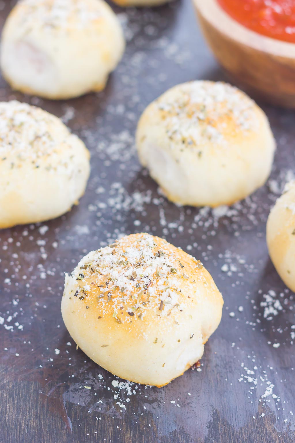 These Stuffed Pizza Rolls taste just like your favorite pizza, combined into a roll and drizzled with a zesty, buttery glaze! #pizza #pizzarolls #stuffedpizza #pizzabread #pizzappetizer #pizzarecipe #rolls #appetizer